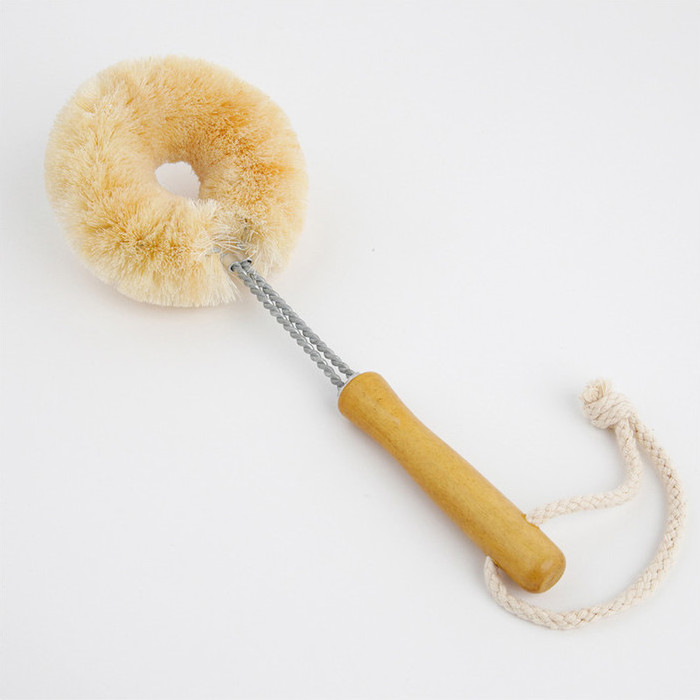 Scrubbing brush with wooden handle and hanging loop
