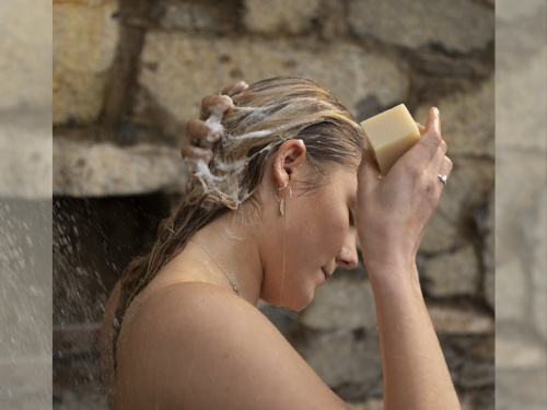 Woman washing hair with shampoo bar