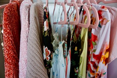 second hand clothes online hanging on a rack